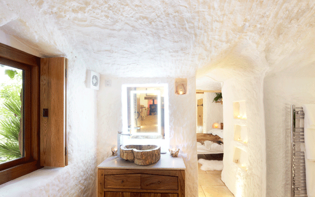 Stone basin on a single vanity unit in the bathroom of the Grand Designs cave house
