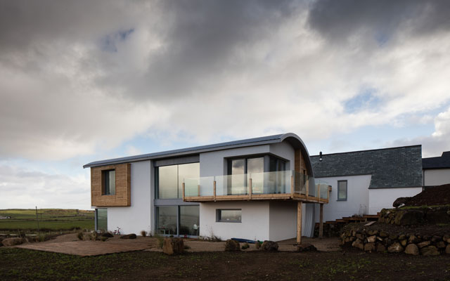 Exterior view showing a central section of floor-to-ceiling glazing 