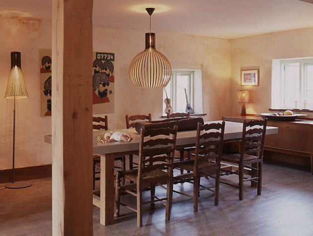 A farmhouse-style dining table in the Hampshire Dairy Cottage from Grand Designs