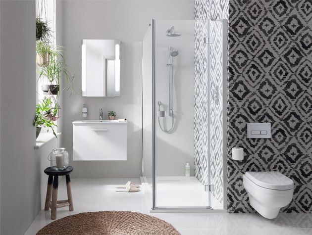 corner shower in white bathroom with monochrome shower tiles