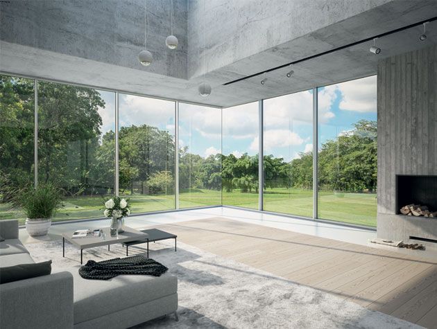 contemporary living room with large glass windows and doors looking out to forest view copy
