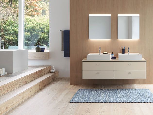 Bathroom with wooden flooring and a twin basin with mirrors -duravit-home-improvements-granddesignsmagazine.com