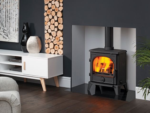 Black stove in grey living room -capital-fireplaces-home-improvements-granddesignsmagazine.com