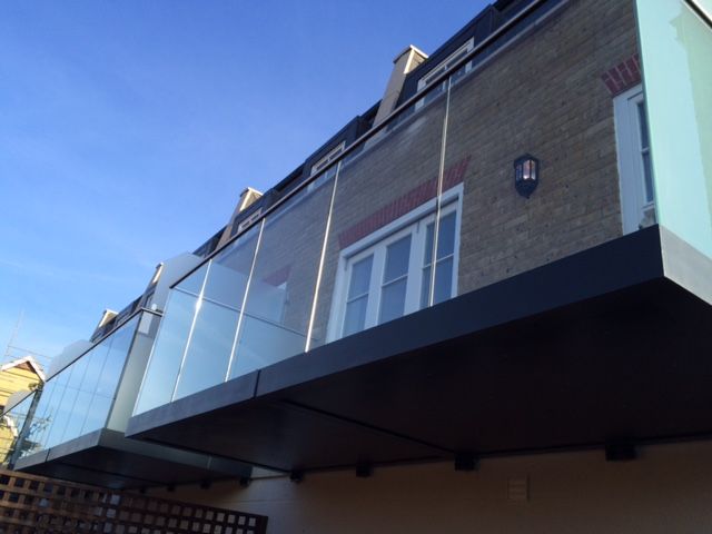 Flat with glass balcony -balconylife-home-improvements-granddesignsmagazine.com