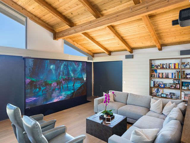 An American style living room with grey sofas and 85 inch Sony TV -dsi-luxury-technology-home-improvements-granddesignsmagazine.com