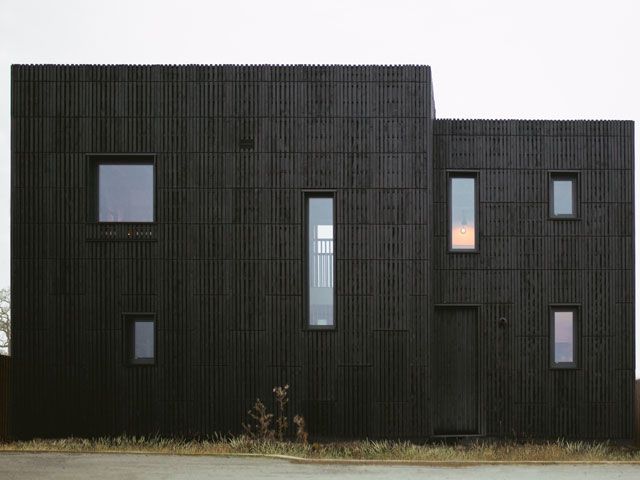 The dark exterior of u build box house in Graven Hill featured on My Grand Design on Channel 4, designed by studio bark