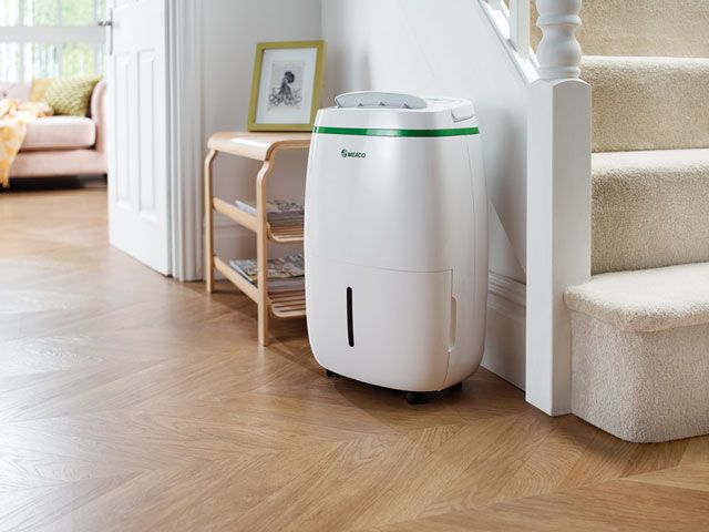 Meaco dehumidifier in hallway next to stairs