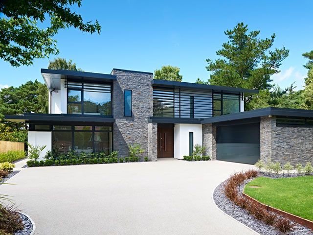 modern house with large wide driveway with greenery, Canford cliffs, David James Architects