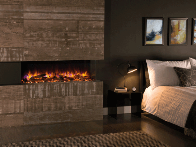 A modern multi sided gas fire in a bedroom