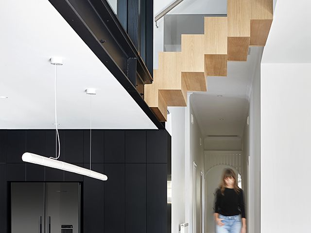 whiting architects melbourne home extension living areas open plan high ceilings with floating staircase - granddesigns 