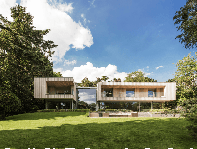 Rear elevation of a modern house surrounded by trees