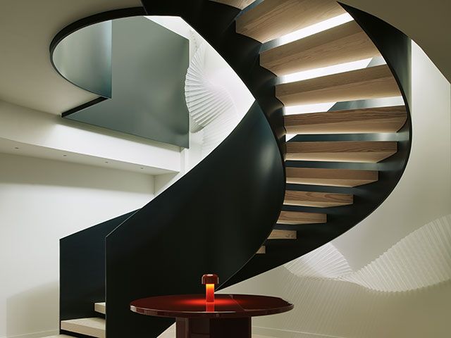 curved staircase in converted television centre apartment - grand designs 