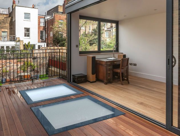 a contemporary home with sliding door and rooflights