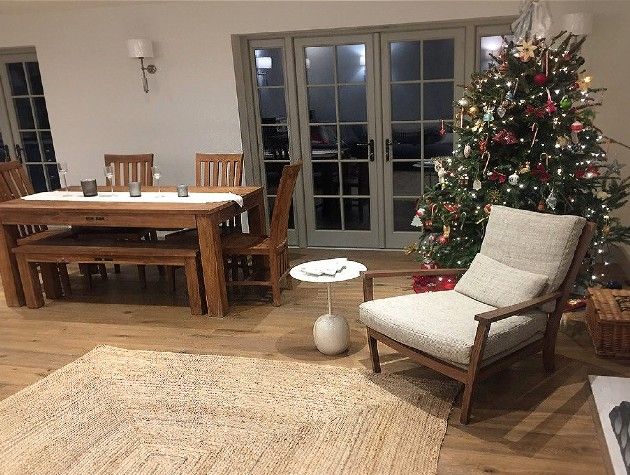 a lounge and dining area with Christmas tree