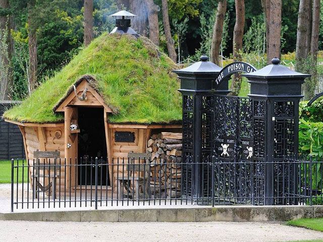 wooden garden cabin with grass roof