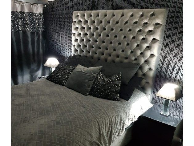 bedroom with bed and upholstered headboard