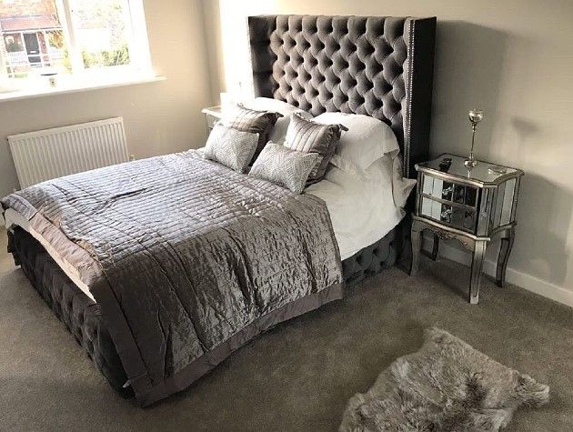 bedroom with bed headboard bedside table and rug