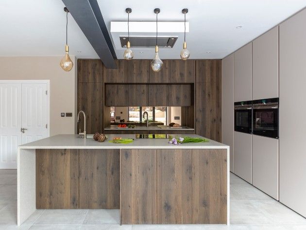 contemporary kitchen with wood finish and pendant lights