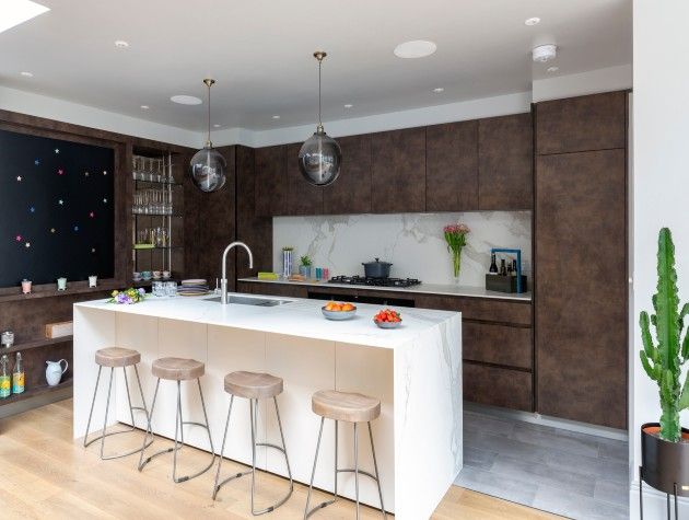 fitted kitchen with island and four stools