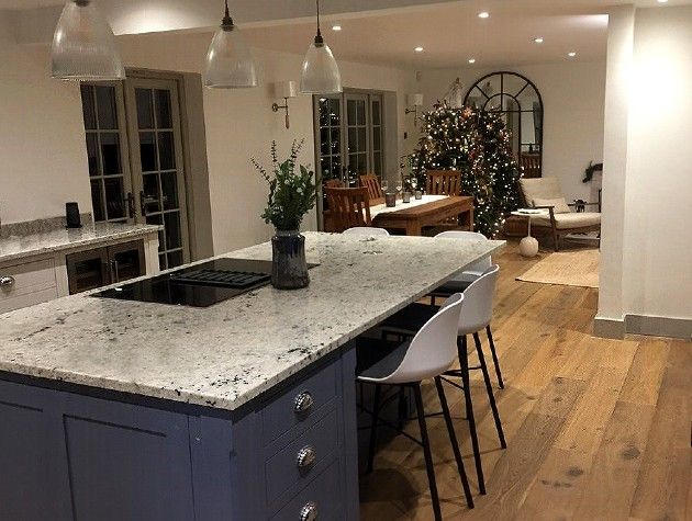 kitchen and dining area with wooden floor and Christmas tree