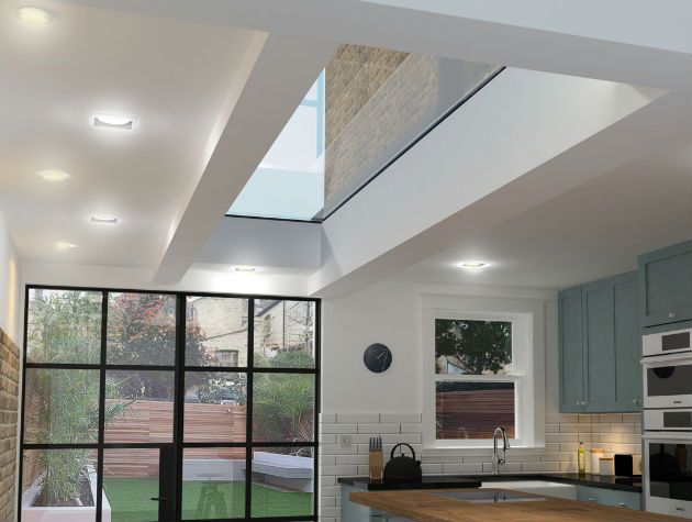 kitchen with rooflight, island stools and view out to garden
