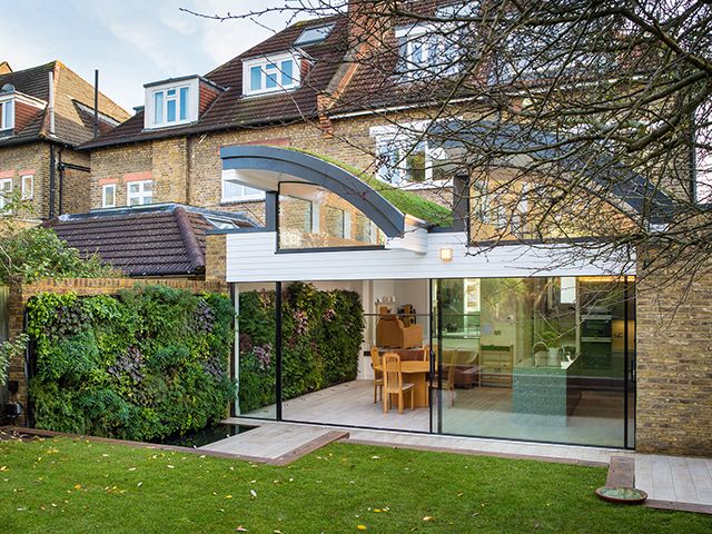 living plant wall in property designed by One World Design Architects. Photography by charlie turner - grand designs