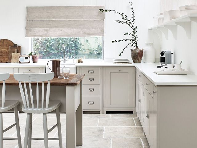 stone coloured kitchen with white work surface - 6 steps to your perfect kitchen - home improvements - granddesignsmagazine.com