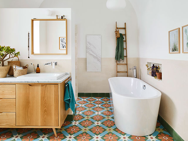 converted bathroom in monastery with graphic tiles and freestanding bath - grand designs