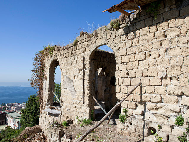 exterior of a ruined monastery on naples hillside - granddesigns 