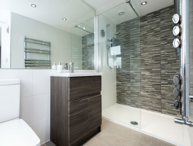 bathroom with toilet vanity unit and walk in shower