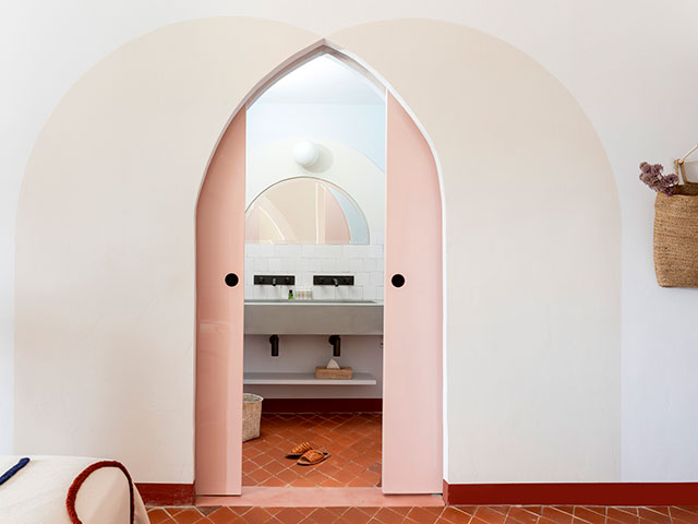 hotel ensuite with pink pocket door - grand designs 