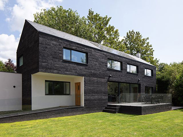 charred timber self build made with sips - grand designs 