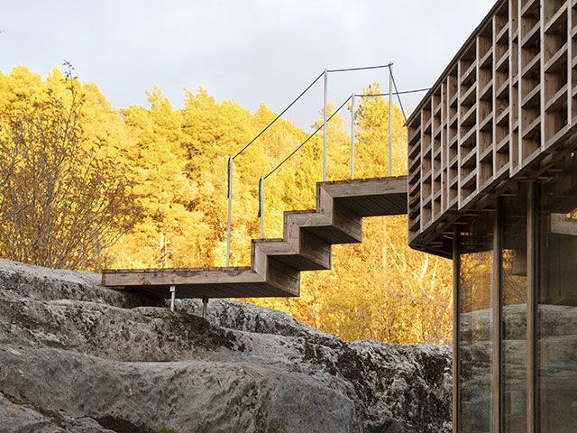 stairs leading from rocks to self-build timber home - grand designs