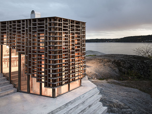 a self build on an island with a intricate wooden facade - grand designs 