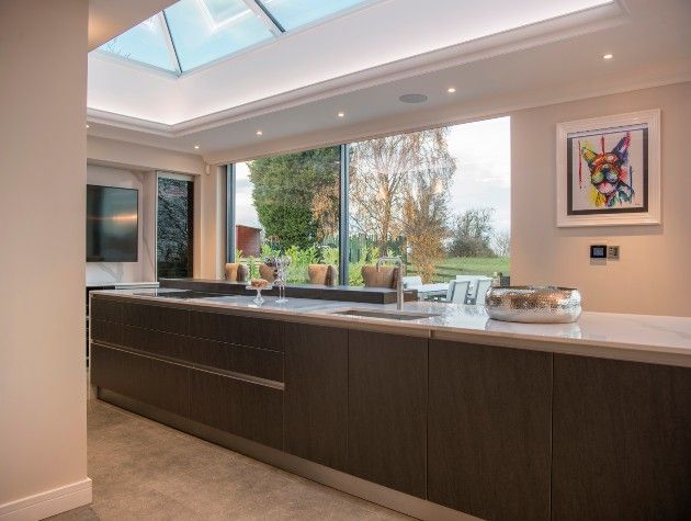 kitchen with long central island and sliding patio doors