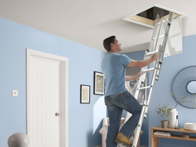 man climbing up loft ladder