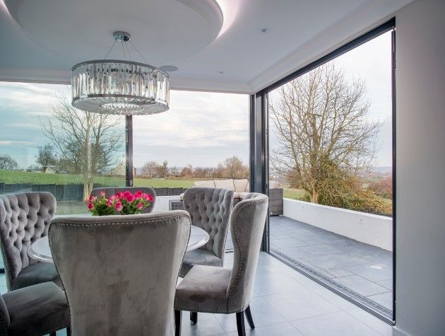 table and chairs with large sliding doors out to patio