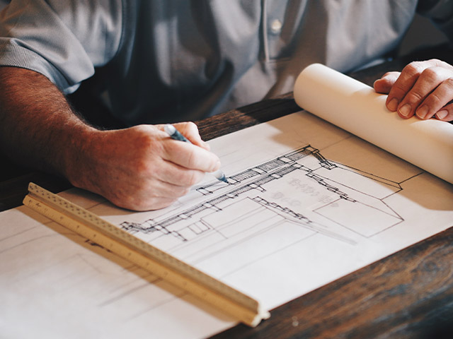 architect drawing plans - how to plan for your dream self-build - self build homes - granddesignsmagazine.com
