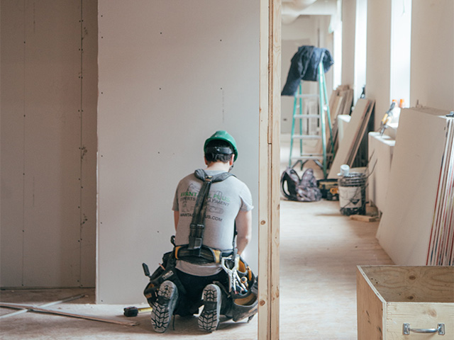 construction site worker - how to resolve conflicts with your builder over outstanding work - self build homes - granddesignsmagazine.com 