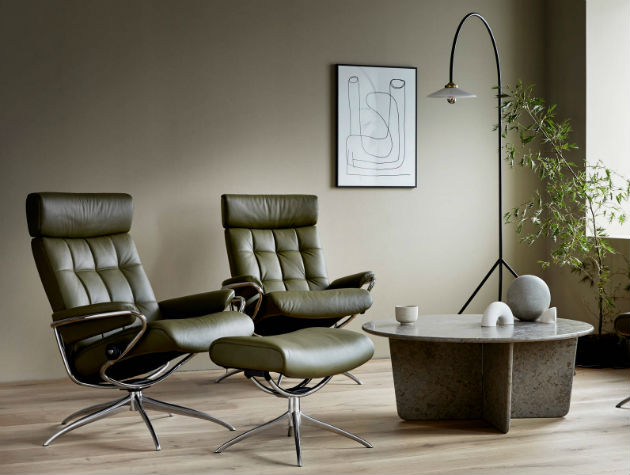 two reclining seats with footstools light and table