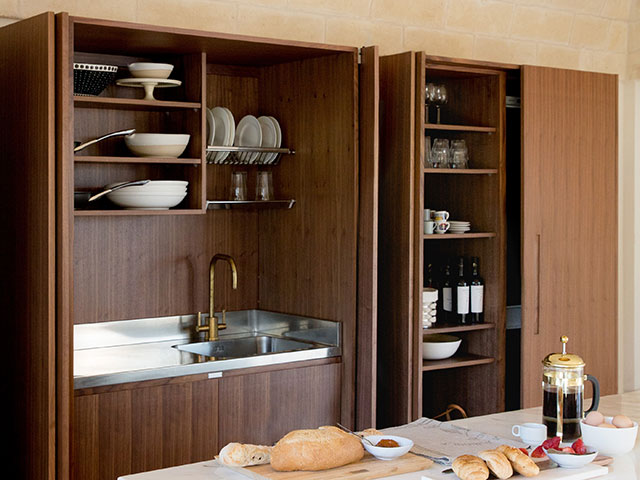 Modern kitchen with freestanding pocket door cabinetry - sola kitchens - grand designs