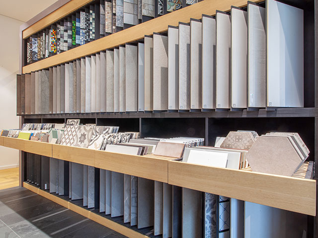 shelves with tile samples” - self build - grand designs