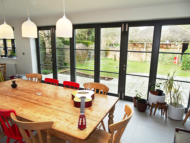 timber french doors in dining room - grand designs - self build