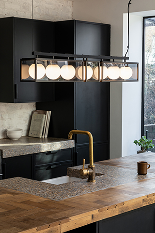 industrial bulb pendant light - 4 different ways to use lighting in your kitchen design - home improvements - granddesignsmagazine.com