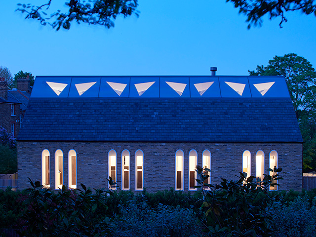 exterior of chapel conversion at nighttime - grand designs