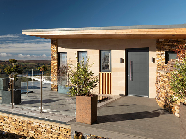 modern timber door on self build homes - grand designs 