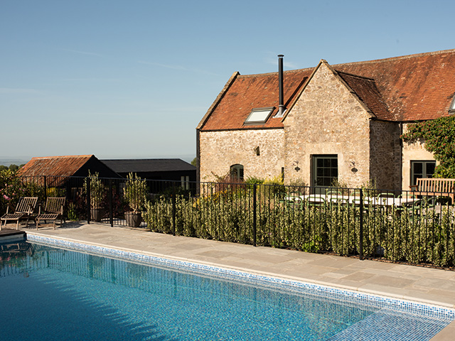 self-build outbuilding, next to main house with traditional stone walls, in the countryside - grand designs