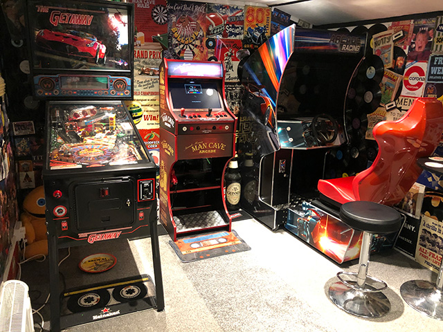 arcade room in a home with variety of machines