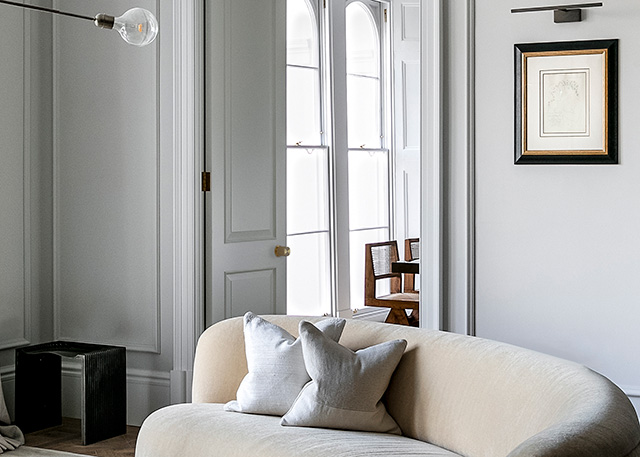 modern stylish living room with panelled walls and dividing doors - grand designs