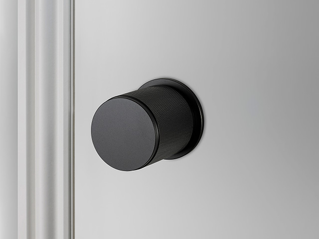 black industrial door knob on a door - grand designs 